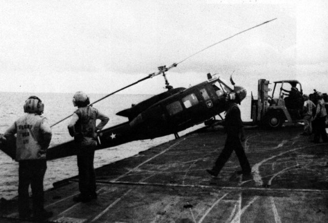 sVNAF_Huey_is_pushed_over_the_side_of_USS_Hancock_(CVA-19)_1975.Source