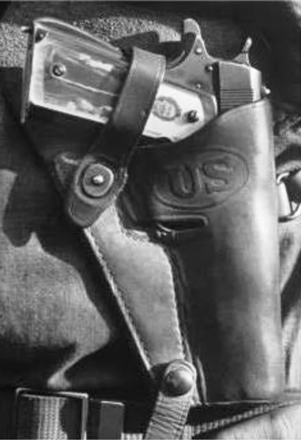 Closeup of pistol grip w. photo of girlfriend of Lt. John Ernser, 26, leader of the US infantry engaged in attacks of German fortification positions at the Italian front, 88th US Inf Div, 1944. source