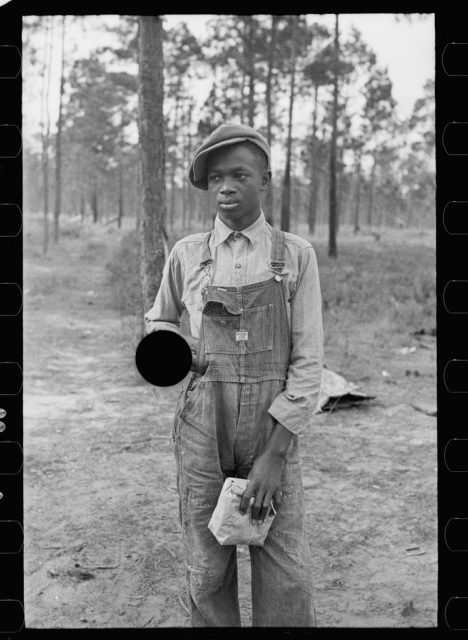 Boy selling pecans by road, near Alma, Georgia.
