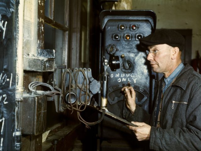 A hump master operates a switch system to control the movement of locomotives through the yard.