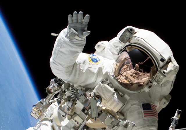 Astronaut Heidemarie M. Stefanyshyn-Piper waves at the camera during a spacewalk.Source:NASA