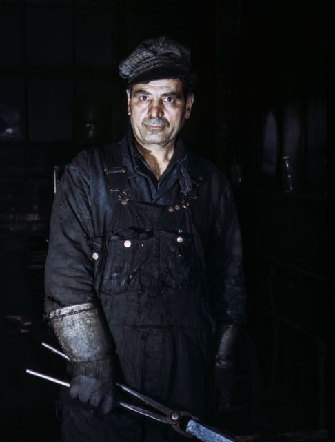 Daniel Anastazia, blacksmith's helper at the roundhouse of the Rock Island Railroad, Blue Island, Illinois.