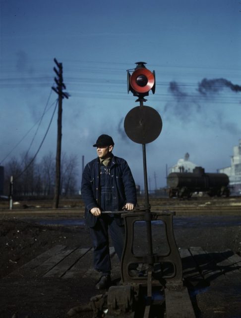 Daniel Senise throws a switch in an Indiana Harbor Belt Line Railroad yard.