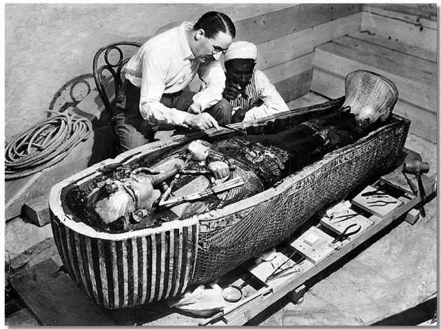 Howard Carter opens the innermost shrine of King Tutankhamen’s tomb near Luxor, Egypt which one of Carter’s water boys found the steps down to.