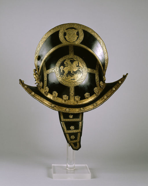 A morion is a light helmet for soldiers on foot or horseback with a distinctive comb along the top and an upturned brim. They are decorated with studs and often with etching, paint, and gilding. Source