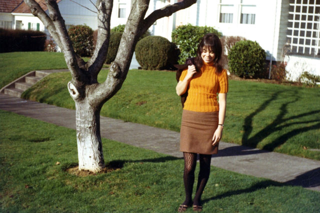 American girl wearing a mini skirt and patterned tights, 1966. Source