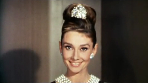 Cropped screenshot of Audrey Hepburn from the trailer for the film Breakfast at Tiffany's Source