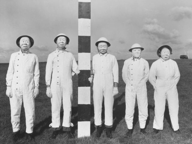 Field trial personnel in 1956. The masks had to be worn to allow the collection of proxy warfare substances that had been sprayed from aircraft Imperial War Museums