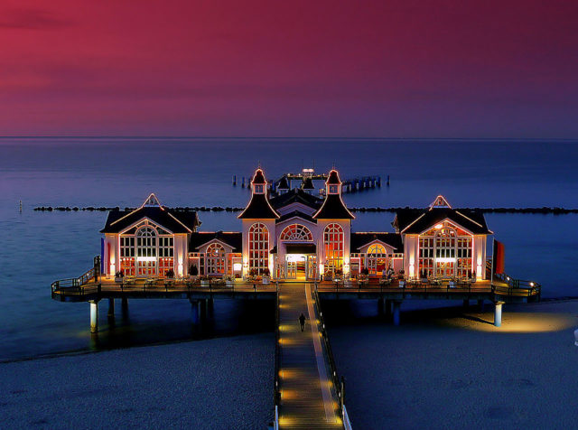 Illuminated Sellin Pier at dusk Source