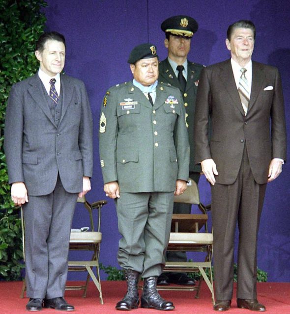Army Master Sgt. Roy P. Benavidez is flanked by Defense Secretary Caspar Weinberger (left) and President Ronald Reagan at his Medal of Honor presentation ceremony in 1981. Source