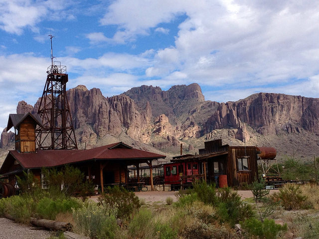 Situated atop a small hill between the Superstition and Goldfield Mountains. Source