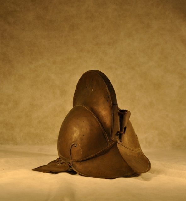 Smooth metal helmet with protective neck and ears. Source