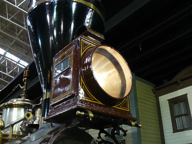 The locomotive’s headlamp, now converted to an electric bulb, originally burned kerosene. Source