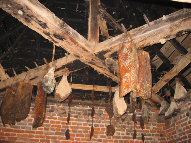 Hanging meat inside the smokehouse. Source:Madmiked/Flickr