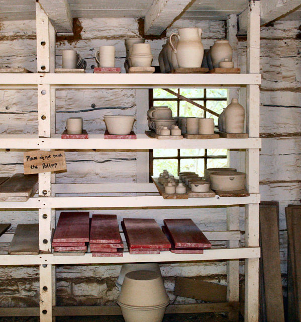 pottery on a traditional drying rack.Source