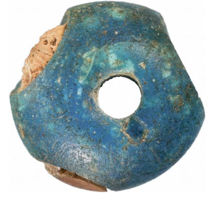 A glass bead found in a 3400-year old Danish grave Photo Credit: Denmark National Museum