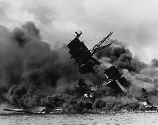 The USS Arizona burning after the Japanese attack on Pearl Harbor, 7th of December, 1941. Source: Wikipedia / Public Domain