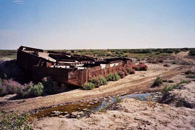 A rusting fishing boat lying on the aral seabed near Moynaq. Source