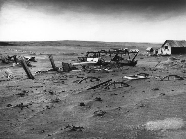 Buried machinery in a barn lot; Dallas, South Dakota, May 1936