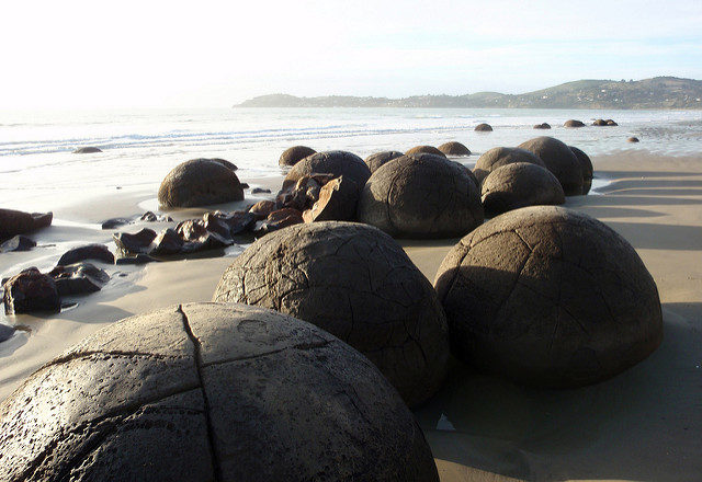 The Moeraki Boulders are concretions created by the cementation of the Paleocene mudstone of the Moeraki Formation. Source