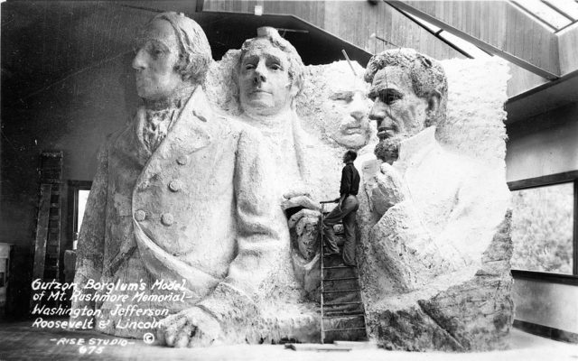 A model at the site depicting Mount Rushmore’s intended final design