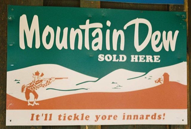 1950s Mountain Dew advertisement sign in Tonto, Arizona showing the cartoon character "Willy the Hillbilly". By Bellczar (talk) - I (Bellczar (talk)) created this work entirely by myself., CC BY-SA 3.0, https://en.wikipedia.org/w/index.php?curid=23896256