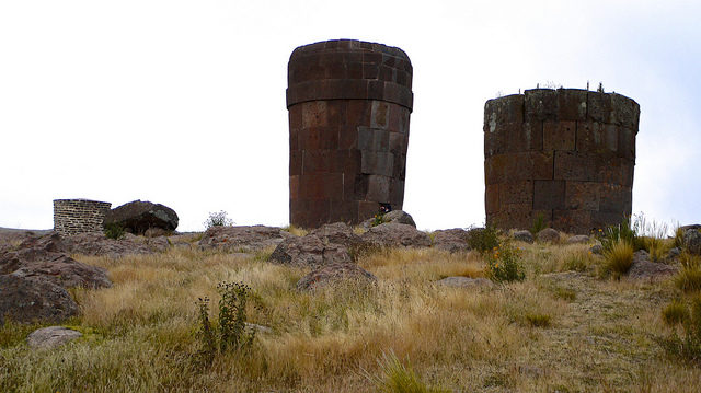 A cemetery full of chullpas, circular stone buildings in the form of towers. By Marie Thérèse Hébert & Jean Robert Thibault Flickr CC BY-SA 2.0