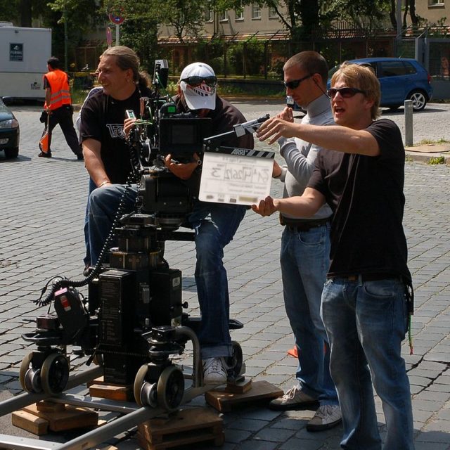 A clapperboard in use. By Ralf Roletschek (talk) - Own work; de:User:Ralf Roletschek, Fahrradmonteur.de, GFDL 1.2, https://commons.wikimedia.org/w/index.php?curid=7107349