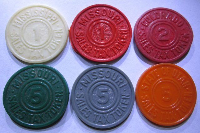 A number of states issued colorful plastic tax tokens made in quantities running into hundreds of millions. The denominations on the token are numbers of mills (tenths of one cent). By $1LENCE D00600D at English Wikipedia, CC BY-SA 3.0, https://commons.wikimedia.org/w/index.php?curid=32892050