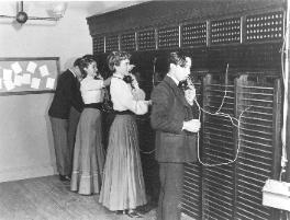 This scene from "Bold Experiment – the Telephone Story", depicts the first women operators, Emma and Stella Nutt, working alongside boy operators at the Edwin Holmes Telephone Despatch Co. Boston, Massachusetts in 1878.