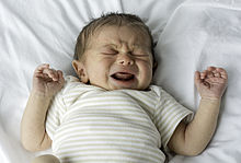 A crying newborn, a few days after birth