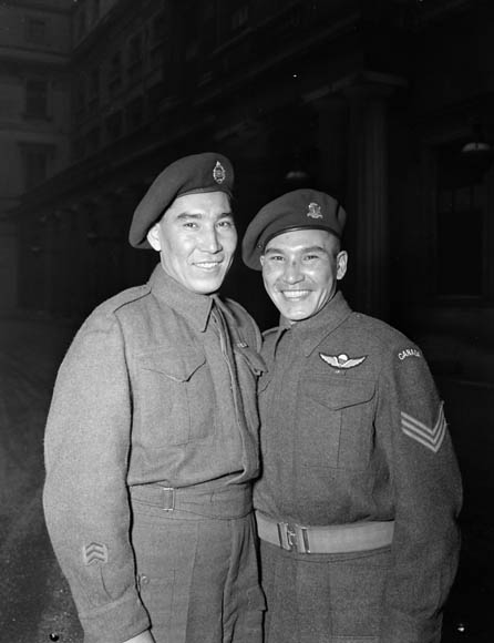 Sergeant Tommy Prince (R), M.M., 1st Canadian Parachute Battalion, with his brother, Private Morris Prince, at an investiture at Buckingham Palace, 12 Feb 1945.