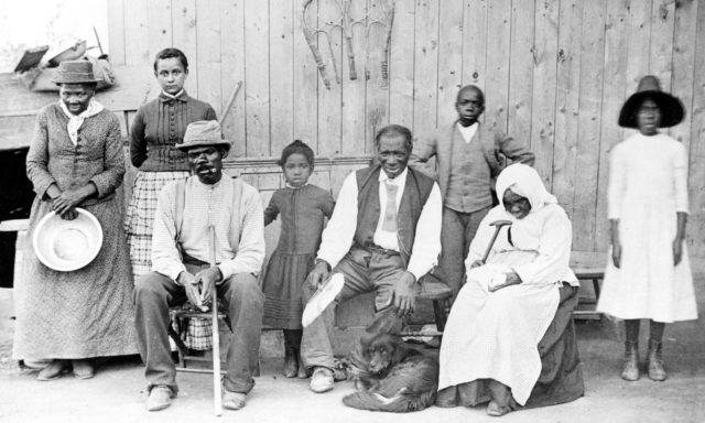Tubman with family and neighbors at her home in Auburn, NY, 1887. Image by -Wikipedia, Public Domain