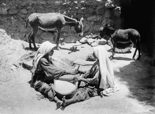 two-women-work-at-a-millstone