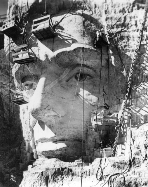 Pallets dangling in front of Abraham Lincoln's head in Mount Rushmore