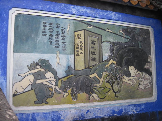 Mural in Fengdu Ghost City shows evil people falling to the underworld and being eaten by monsters. Photo Credit