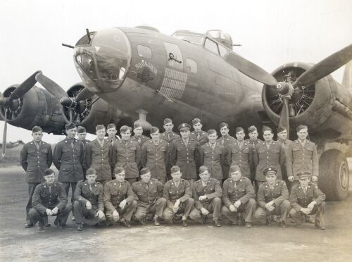 “SQUAWKIN’ HAWK” poses with the Armament section of the 349th 