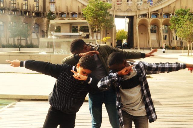 Cool Kids posing in front of the octagonal buildings Les arènes de Picasso