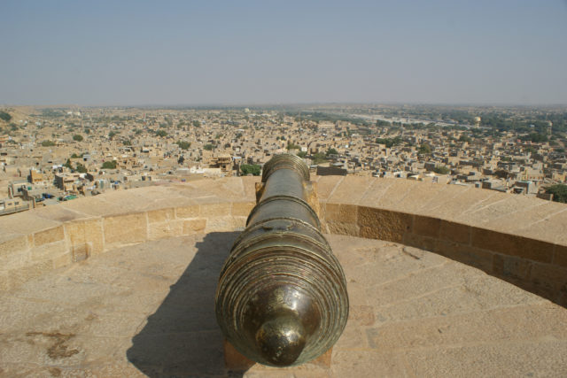 A cannon guards one of the four entrances to the town. Photo Credit