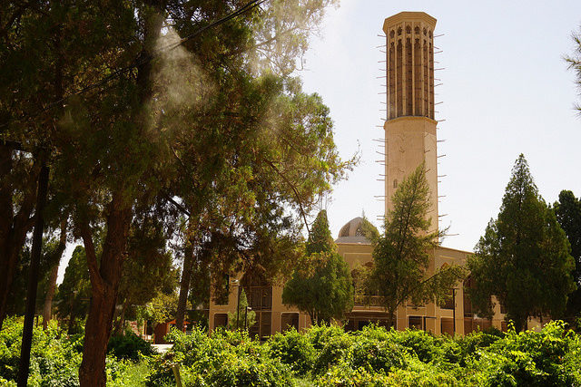 A capped tower with an open side facing the wind simply and effectively brings down cooling drafts in to the heart of the structure below. Photo Credit