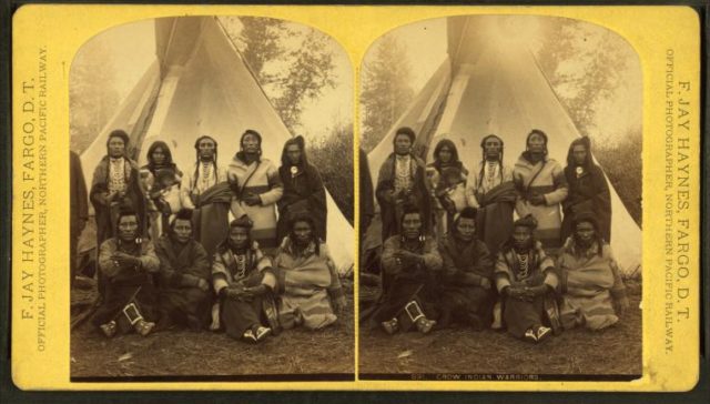 Crow Indian warriors. (Group posing in front of a teepee.), by Haynes, F. Jay (Frank Jay), 1853-1921