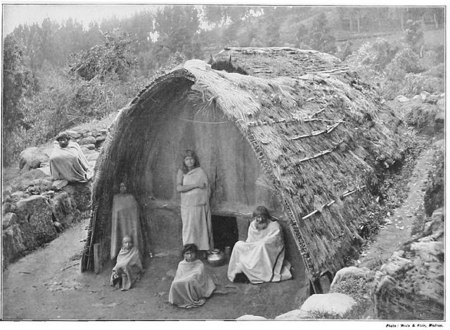 Dressed stones (mostly granite) usually make up the front and back of the hut