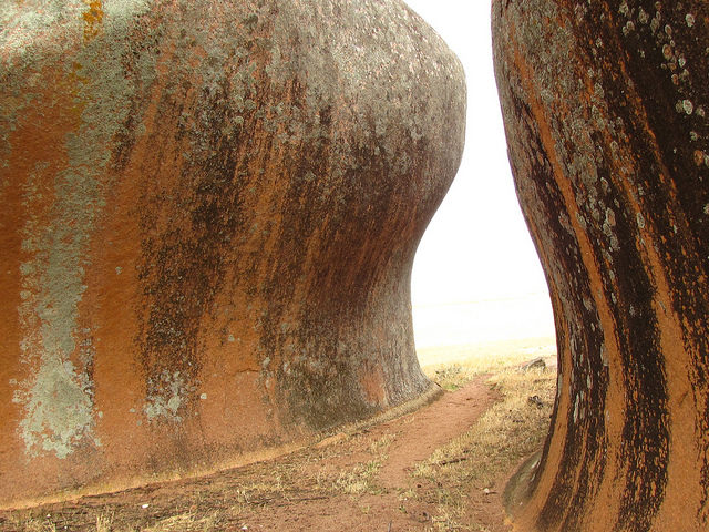 Murphy’s Haystacks are what geologists call inselberg, which forms when a body of hard rock surrounded by a layer of soft rock becomes exposed to erosion. Photo Credit