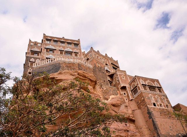 Perched atop a rock pinnacle at the famous Wadi Dhahr Valley. Photo Credit