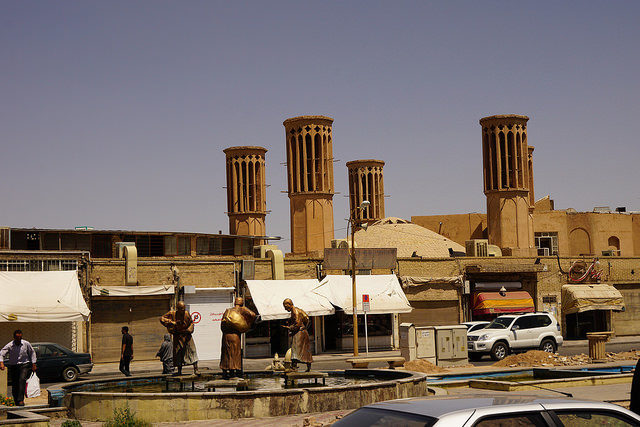 Windcatchers have various functions, but one of the most common includes the combination of a tall-capped tower with an underground canal to store the wind power in addition to being a cooling system. Photo Credit