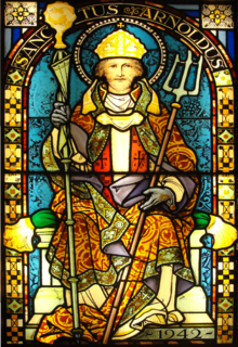 St. Arnold of Soissons is often depicted with a bishop's mitre and a mash rake. Photo credit