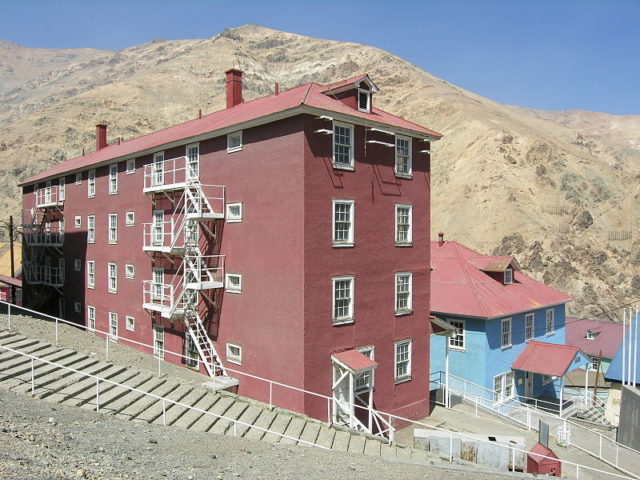 The buildings lining the streets are made of timber, often painted in vivid green, yellow, red and blue. Photo Credit