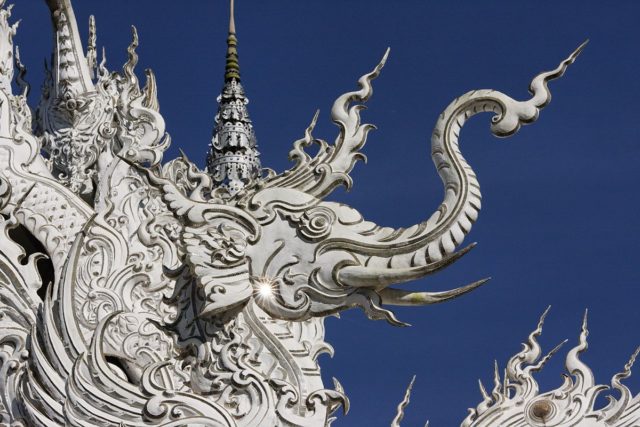 The temple is filled with Buddhist symbolisms, from its layout, architecture, all the way to the ornate reliefs and mirror decorations. Photo Credit