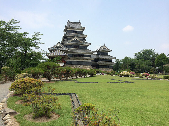 There is a moat around the keep, surrounded by Matsumoto Castle Park. Photo Credit