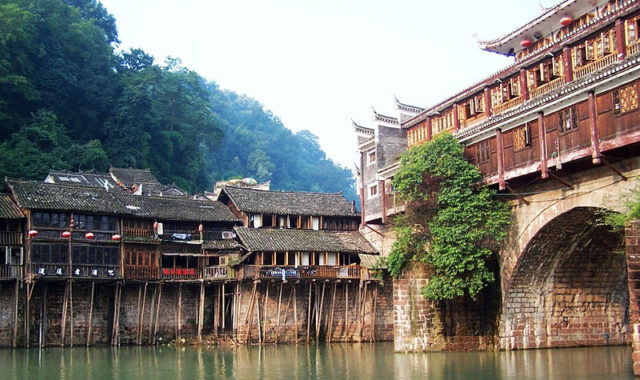 These houses are demonstrating the superb art of architecture of local Miao ethnic group. Photo Ctedit
